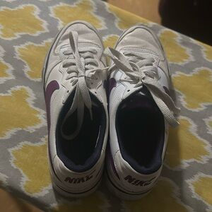 I am selling Nike shoes in the color white and purple in a size 7.